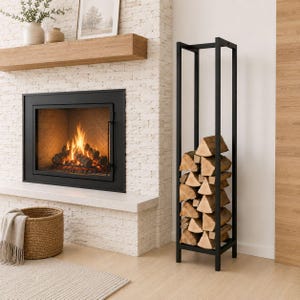 May include: A tall, rectangular black metal firewood rack with a vertical frame design. The rack is filled with stacked, light-coloured split logs. The structure features four thin vertical posts connected by square horizontal supports at the top and base.