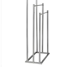 May include: A silver metal towel rack with three bars. The rack has a rectangular base and is made of thin metal.