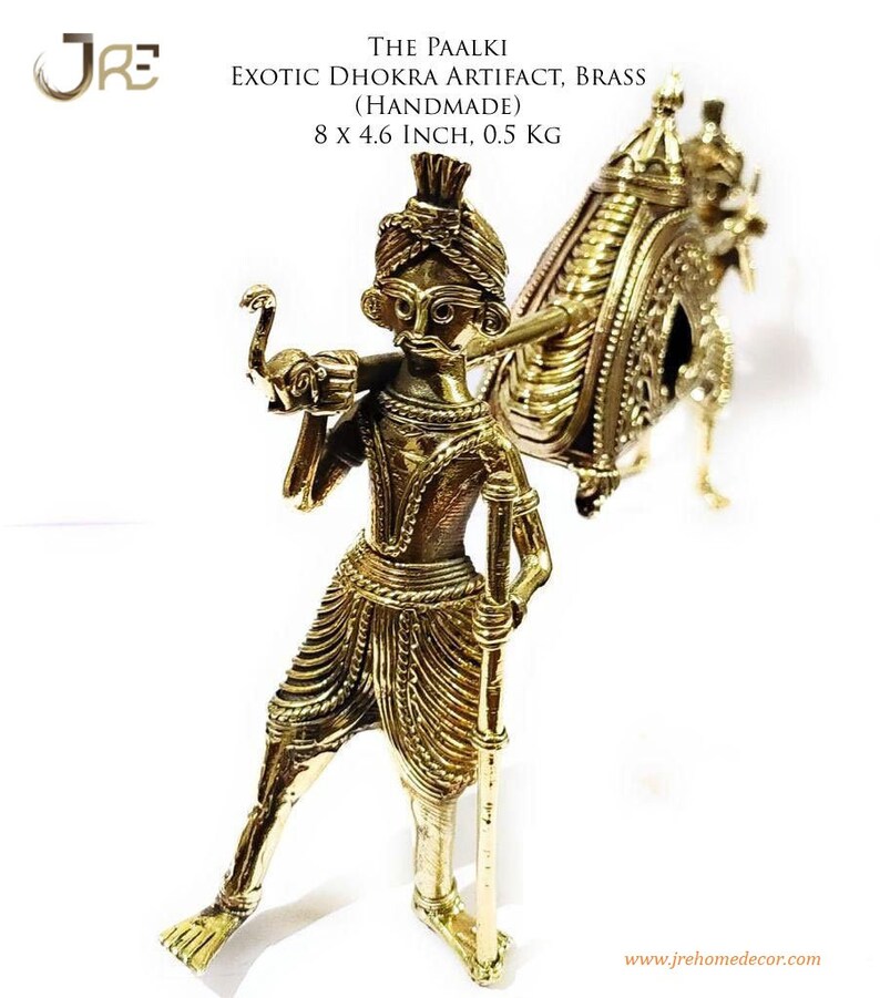 May include: A gold-colored brass sculpture of a person carrying a palanquin, a type of covered litter, on their shoulders. The sculpture is handmade and measures 8 inches by 4.6 inches. The sculpture is called "The Paalki" and is an example of the Dhokra art form.