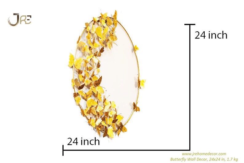 May include: Gold metal wall decor featuring a circular frame with a white background and a design of gold butterflies. The decor measures 24 inches in diameter.