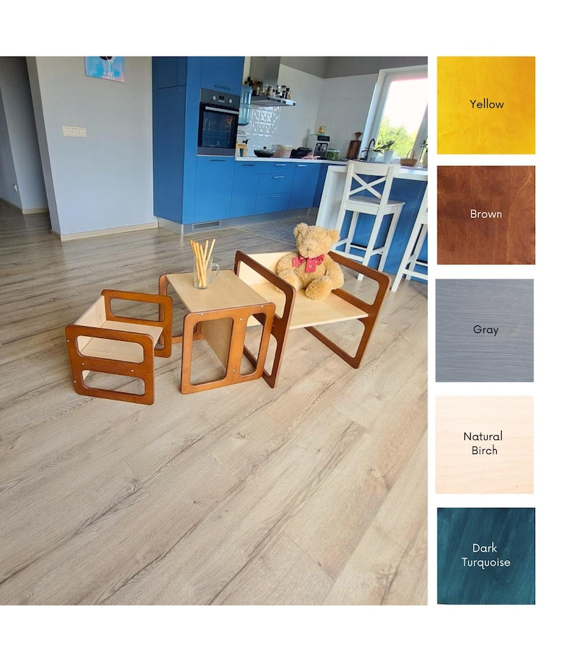 May include: A child's wooden table and chair set with a natural birch tabletop and brown frame. The set includes a small table and two chairs. A teddy bear sits on one of the chairs. The set is on a light wood floor.