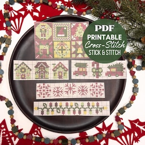 May include: A collection of PDF printable cross-stitch patterns featuring Christmas motifs including houses, cars with trees, snowflakes, and string lights. The designs are displayed on a dark brown plate with a green circular overlay text.