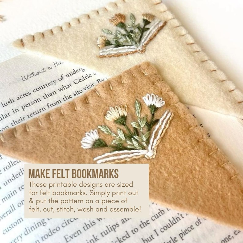 May include: Two handmade felt bookmarks with embroidered floral designs. One is tan, the other is brown. Both have stitched edges and a floral embroidery with white, green, and tan thread. The text on the image says "MAKE FELT BOOKMARKS".