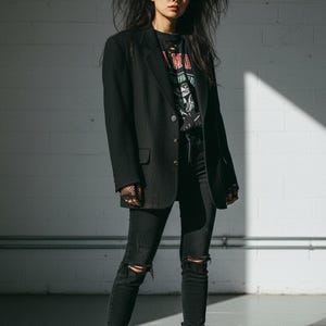 May include: A rustic wooden sign with the text "Welcome to our home" in white lettering. The sign features a distressed finish and a simple, inviting design, perfect for entryway decor.