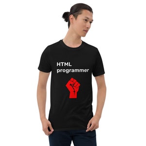 May include: Black t-shirt with white text that reads "HTML programmer" and a red fist graphic.