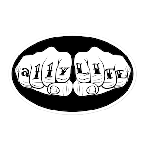 May include: Black and white illustration of two fists with the words "My Life" tattooed on the knuckles.