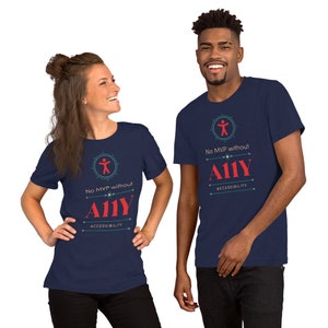 May include: Two people wearing navy blue t-shirts with a red graphic design. The graphic features a stick figure icon, the text "No MVP without A11Y", and the word "ACCESSIBILITY" underneath.