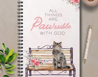 Christian Cat Spiral Notebook with the phrase "All things are PAWssible"