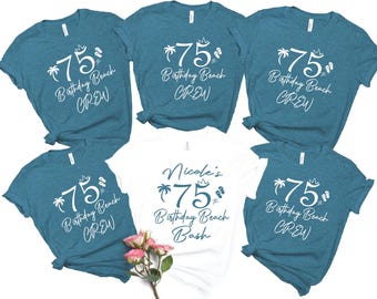 May include: Six teal blue t-shirts with white text. The shirts say "75 Birthday Beach Crew" and "Nicole's 75 Birthday Beach Bash".