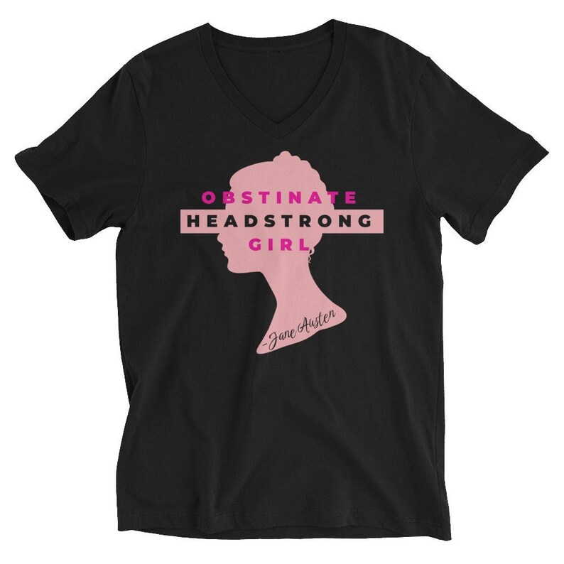 May include: Black V-neck t-shirt with a pink silhouette of a woman's head and the text "Obstinate Headstrong Girl - Jane Austen" in pink.