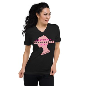 May include: Black V-neck t-shirt featuring a pink silhouette of a woman's head and the text "Obstinate Headstrong Girl" in pink and magenta. The text "Jane Austen" is written in pink below the silhouette.