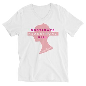 May include: White V-neck t-shirt with a pink silhouette of a woman's head and the text "Obstinate Headstrong Girl - Jane Austen" in pink and magenta.