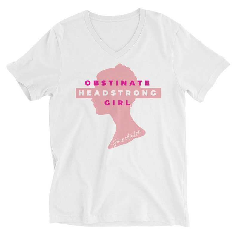 May include: White V-neck t-shirt with a pink silhouette of a woman's head and the text "Obstinate Headstrong Girl - Jane Austen" in pink and magenta.