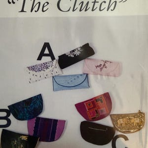 May include: Image of a sewing pattern titled "The Clutch" with various clutch designs. The clutches are in different colors and patterns, including floral, geometric, and embroidered styles. The pattern is by Shirley Adams.