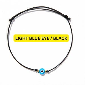 blue evil eye bracelet with black string