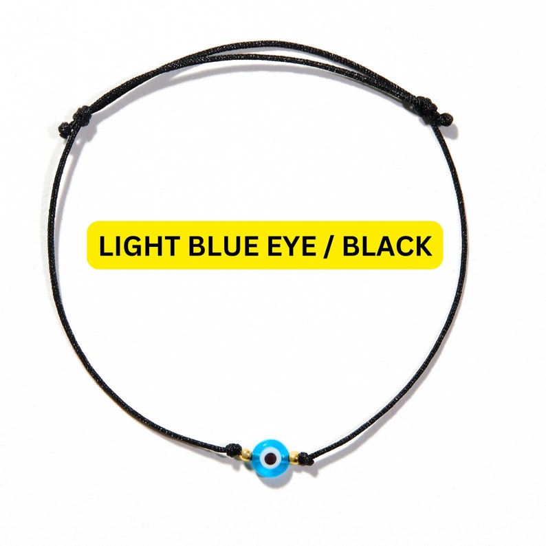 blue evil eye bracelet with black string