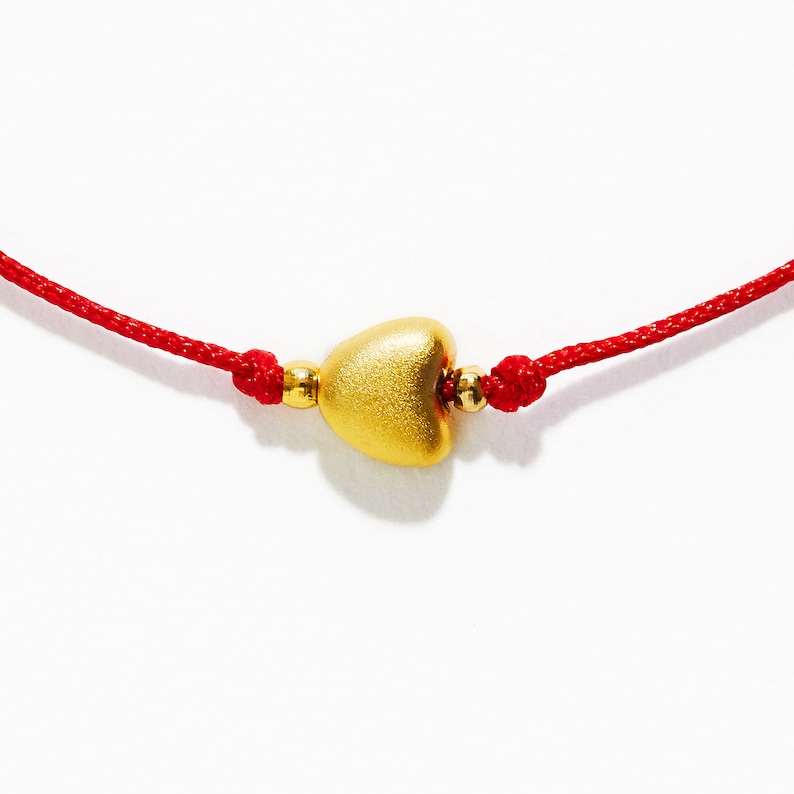 red string bracelet