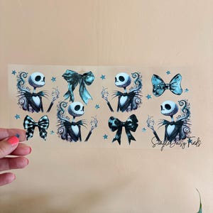 May include: A sheet of stickers featuring Jack Skellington from The Nightmare Before Christmas. The stickers include images of Jack and various bows in shades of black, blue, and white. The text "Simple Daisy Finds" is also visible.