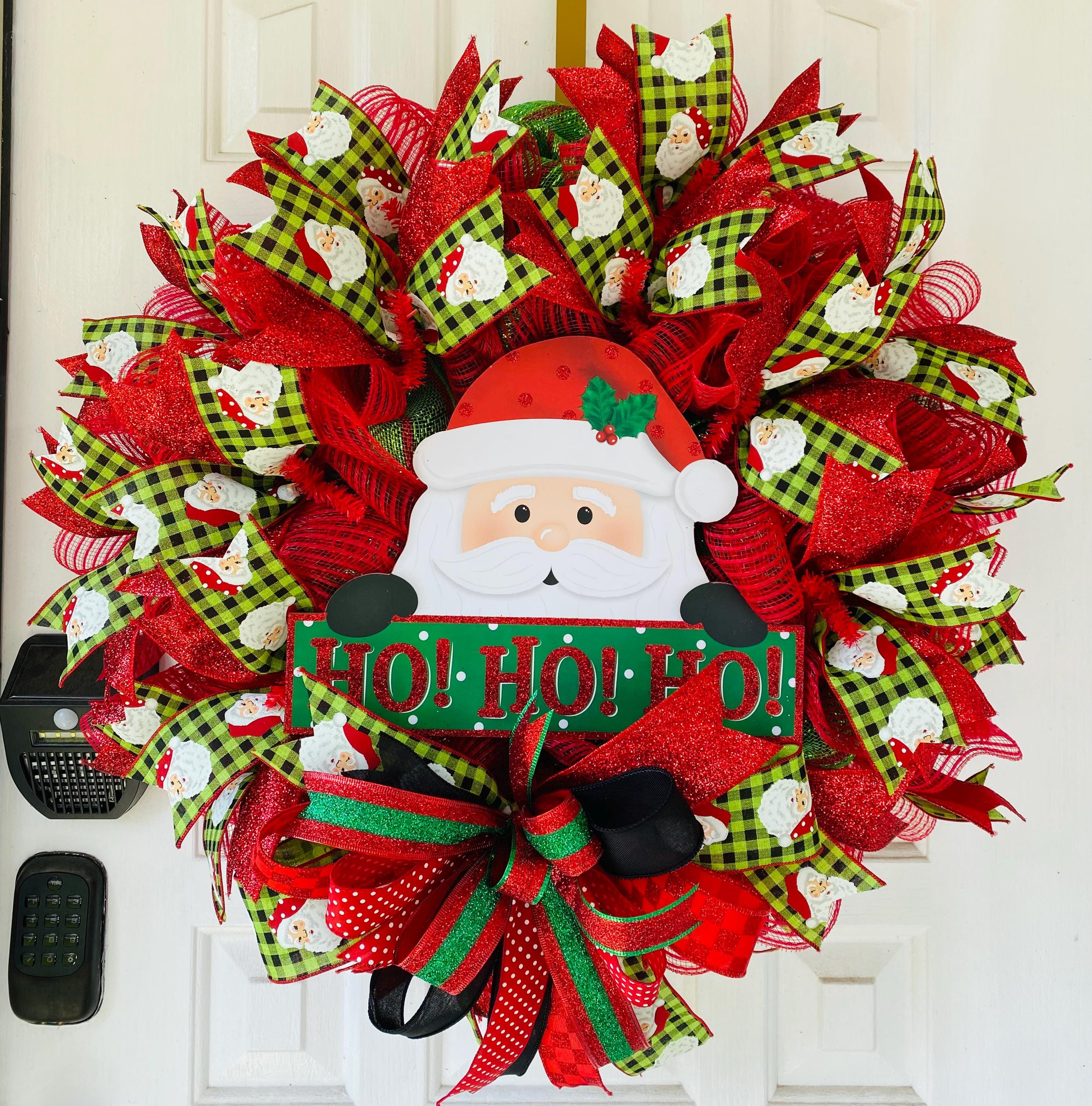 サンタのクリスマスリース - お祝いのホリデードアデコレーション