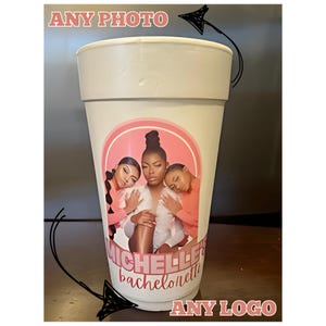 May include: White foam cup with a pink and white sticker featuring a photo of three women and the text "Michelle's Bachelorette".