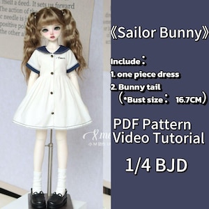 May include: A white sailor dress with navy blue trim and buttons on a doll. The doll has blonde pigtails and is wearing black shoes. Text on the image reads "Sailor Bunny" and "1/4 BJD".