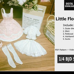 May include: A doll clothing set featuring a pink outer dress with white lace trim, a white shirt, petticoat, hairband, and socks. The set is designed for a 1/4 BJD size doll. The image includes the text "Little Flower".