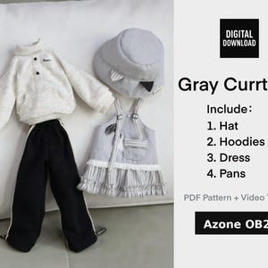 May include: A doll clothing set in gray and white, including a hat, hoodie, dress, and pants. The outfit features a gray hat with a black accent, a white hoodie, a gray dress with striped trim, and black pants with white stripes.