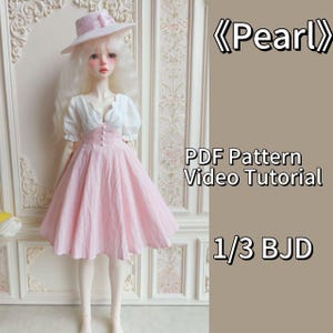 May include: A pink dress with a white blouse and a white hat for a 1/3 BJD doll. The dress has a high waist and a full skirt. The doll is standing in front of a white wall with floral patterns. The text "Pearl" and "PDF Pattern Video Tutorial" are visible in the image.
