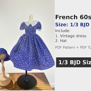 May include: A blue vintage dress with white polka dots and a matching hat. The dress has a white collar and short sleeves. The hat is on a wooden stand. The text on the image says "French 60s" and "1/3 BJD Size".