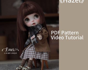 May include: A brown-haired doll wearing a brown coat, a plaid skirt, and a plaid scarf. The doll is sitting on a wooden chair. The doll's name is "Hazel" and the text "PDF Pattern Video Tutorial" is visible. The doll is a Blythe Ob24.