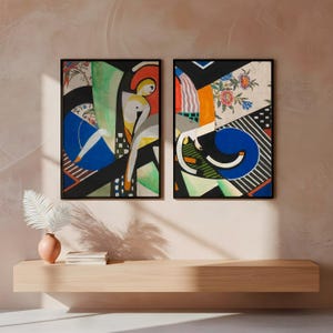 May include: Two framed abstract art prints. Each print features a collage of shapes and colors, including blue, green, black, and orange. One print has a figure with a yellow head and white body. The other print has a blue, curved shape.