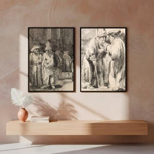 May include: Two framed black and white prints of detailed sketches depicting figures in historical attire. The artwork is displayed on a light-colored wall above a wooden shelf with decorative items.
