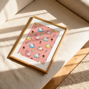 May include: A rectangular wall art print in a gold frame featuring a repeating pattern on a pink background. The design includes white ghosts floating in colorful pool floats, pink flamingo floats, yellow duck floats, ice cream cones, and popsicles.