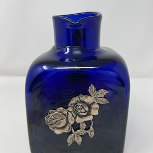 Beautiful Colbolt blue pitcher with pewter rose emblem, handmade