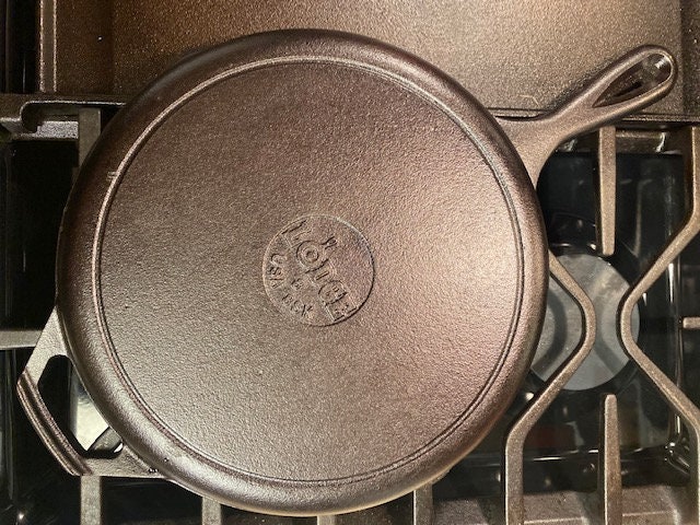 Lodge 10.25 Inch Smooth Inside Bottom Only Cast Iron Skillet made