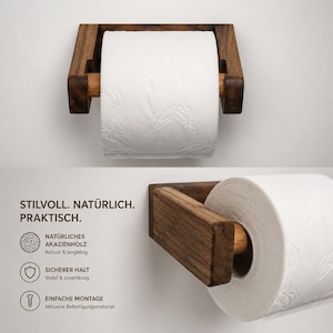 May include: A wall-mounted toilet paper holder crafted from dark brown wood, featuring a horizontal rod that supports a roll of white toilet paper with a subtle embossed leaf pattern. The design includes a rectangular frame and a cylindrical spindle.