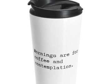 A mug with the phrase 'Mornings Are for Coffee' written on it, symbolizing the start of a new day with warmth.