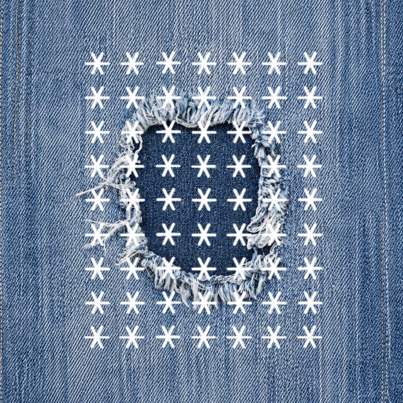 May include: Close-up of denim fabric with a distressed patch. The patch is a square shape with frayed edges, and is filled with white star shapes. The surrounding denim is a medium blue color.
