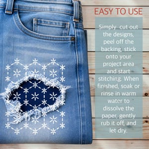 May include: Close-up of blue denim jeans with a distressed patch featuring a white floral design. The text "EASY TO USE" is at the top, with instructions on how to apply the patch.