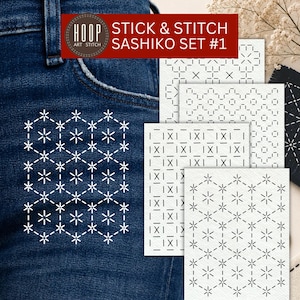 Peut inclure: Un ensemble Stick & Stitch Sashiko Set #1 composé de motifs de broderie adhésifs blancs sur un tissu en jean bleu foncé. Le kit comprend plusieurs feuilles rectangulaires avec des designs géométriques, incluant des motifs en étoile.