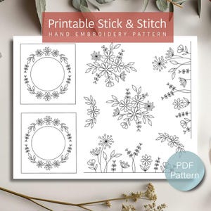 May include: A printable stick and stitch hand embroidery pattern featuring floral designs. The pattern includes two circular wreath designs and various floral and leaf clusters. The text "Printable Stick & Stitch Hand Embroidery Pattern" is displayed at the top.