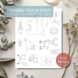 Puede incluir: Patrón de bordado de pegar y coser imprimible con una variedad de animales, incluyendo un oso, una narval, un pingüino, un ciervo, un búho, un zorro y un pez. El patrón es en blanco y negro y está etiquetado como "Patrón PDF".