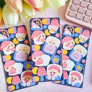 May include: Three sheets of stickers featuring cute cartoon animals in pajamas. The stickers are on a dark blue background with yellow, pink, and white accents. The text "Ssss Bedtime" is on the bottom right corner of the sticker sheet.