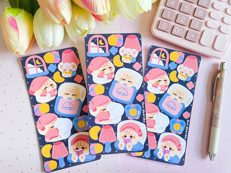 May include: Three sheets of stickers featuring cute cartoon animals in pajamas. The stickers are on a dark blue background with yellow, pink, and white accents. The text "Ssss Bedtime" is on the bottom right corner of the sticker sheet.