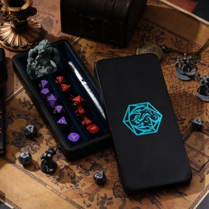 May include: A black leather dice rolling tray with a blue and white design. The tray has a velvet interior with slots for dice. The tray is open and shows a variety of dice, including a d20, d12, d10, d8, d6, and d4. The tray is also shown with a miniature figure of a warrior.