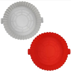 May include: Two silicone air fryer liners. One is light grey, the other is red. Both have a round shape with a fluted edge and a circular pattern in the centre. Each has two small handles on opposite sides.