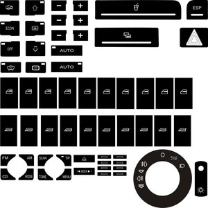 May include: A set of black car control panel buttons and switches with white icons. Includes buttons for window controls, climate control, radio, lights, and hazard lights. The design is minimalist and modern, suitable for automotive applications.