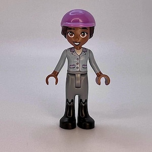 Aliya LEGO® Friends Minifigure with Bright Light Blue Jacket and Sand Blue Trousers.