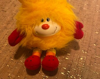 Rainbow Brite Spark Orange Yellow Sprite - 7” - Canary Yellow’s Sprite - With Elastic Loop and claw hand to hold things - 1980s Plush