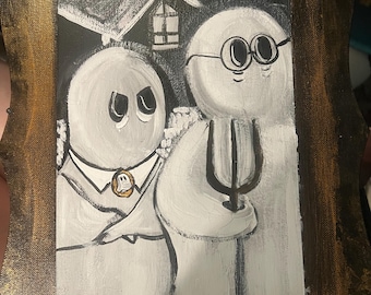 May include: A framed painting in black and white, featuring two ghost-like figures. One is in a suit, the other holds a pitchfork. The frame has a gold-coloured trim.
